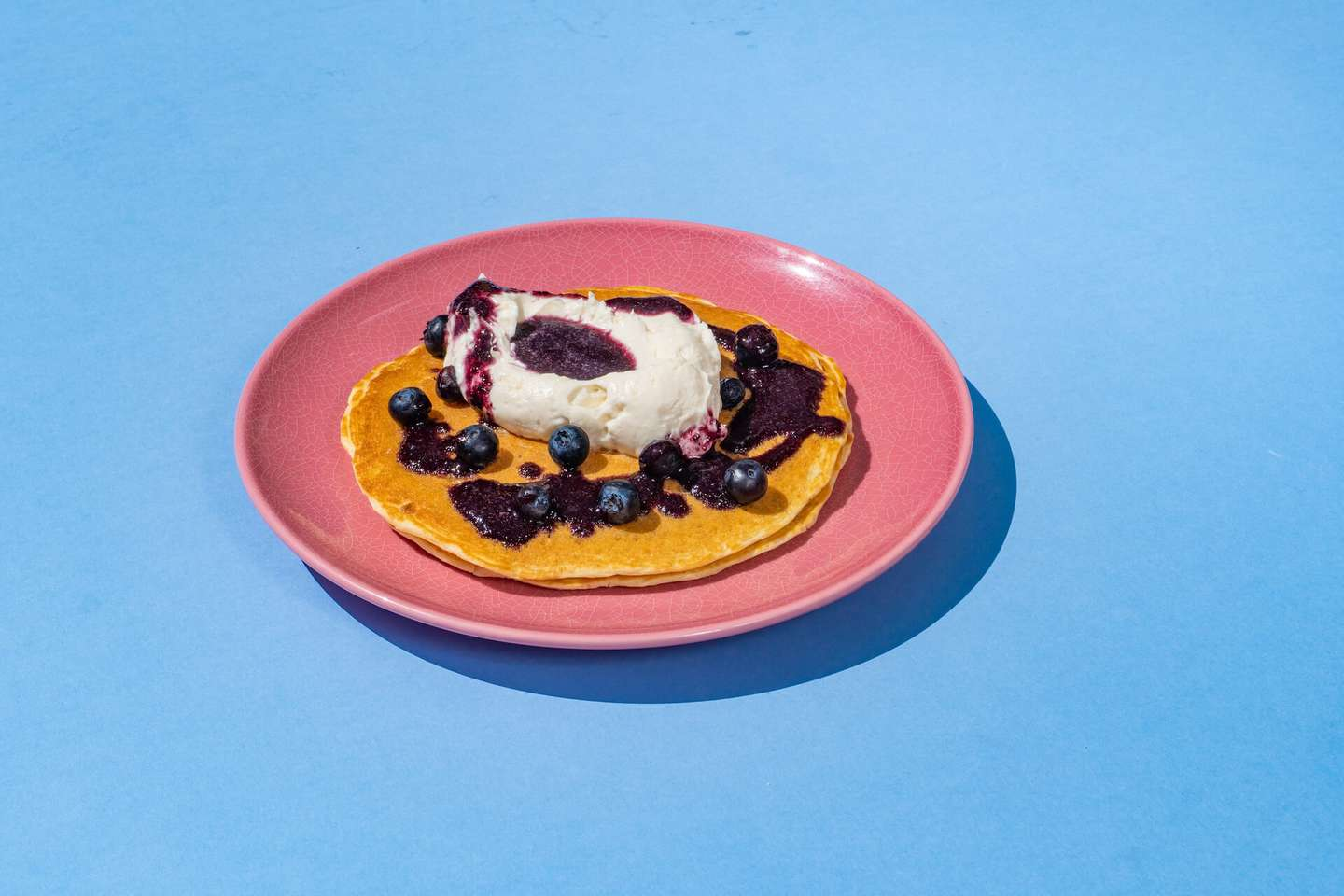 House-made pancake, lemon ricotta cream, blueberry sauce, fresh blueberries