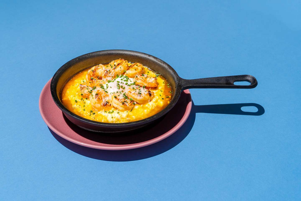 Creamy grits, Tabasco, honey butter, grilled shrimp, farm fresh egg, fresh chives