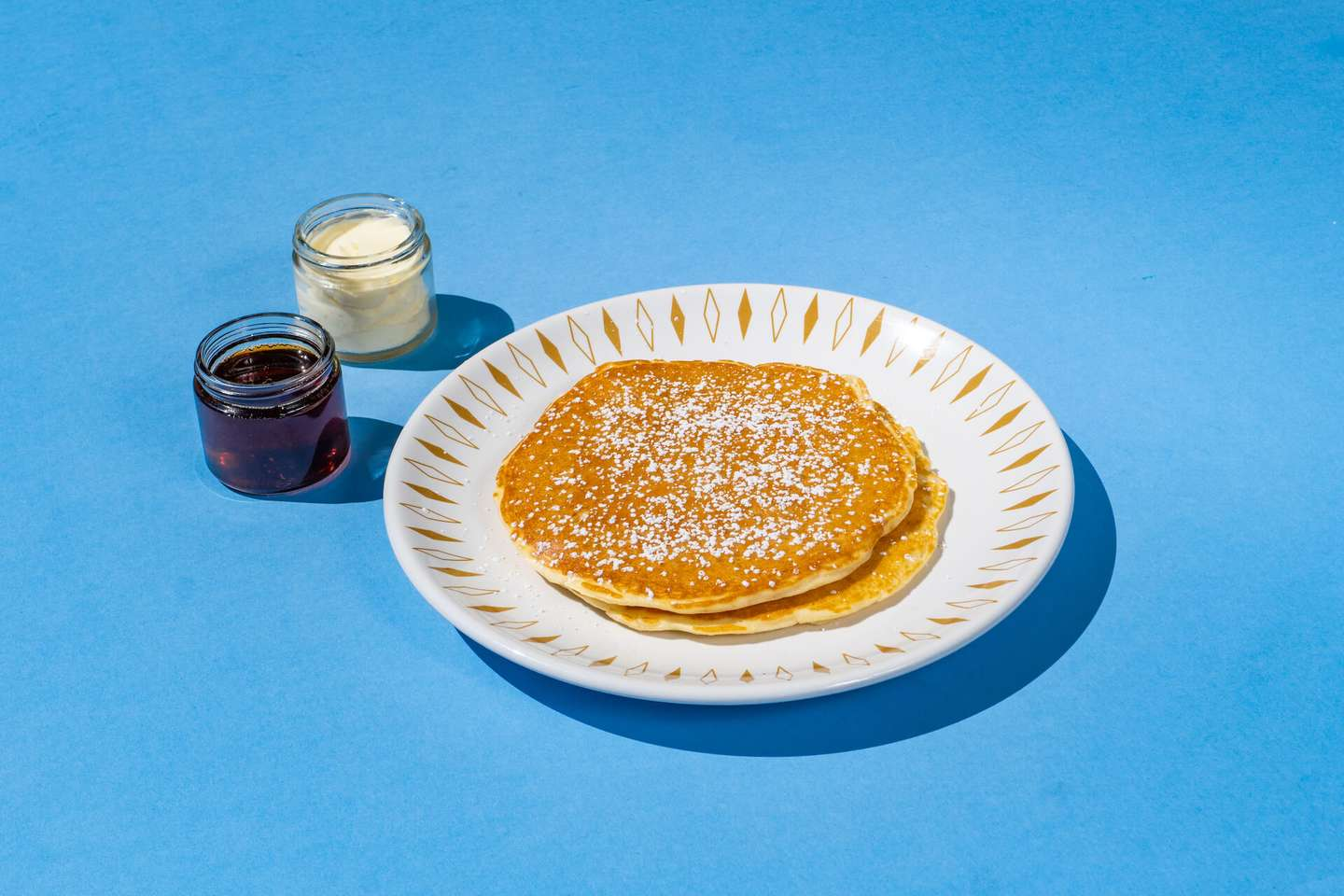 Two house-made pancakes, maple syrup, butter